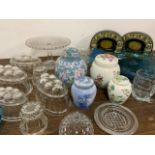 Four lidded ginger jars together with glass jelly moulds and a large quantity of other glassware
