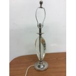 A modern white metal and moulded glass table lamp. 70cm(h)