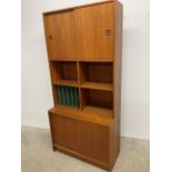 A Danish mid century two piece wall unit. W:88cm x D:40cm x H:186cm