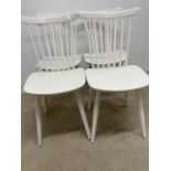 Four white painted stick back chairs possibly Ercol. W:40cm x D:40cm x H:82cm