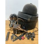 A riding hat, hat box also with binoculars, camera etc