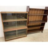 A three section Minty bookcase and a set of pine shelvces. W:89cm x D:29cm x H:108cm W:94cm x D:31cm