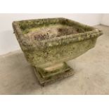 A large stone planter on square pedestal base W:52cm x D:52cm x H:42cm