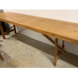 A long trestle table. W:237cm x D:64cm x H:76cm