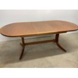 An extending table by Parker Knoll W:208cm x D:104cm x H:75cm