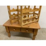 A small pine coffee table with stackable wine racks W:90cm x D:58cm x H:47cm