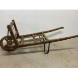 A vintage wooden wheelbarrow W:170cm x D:63cm x H:66cm