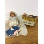 A Pixano toy piano with a Pelham Puppet Tyro Girl and a bruised knee doll.