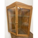 A bespoke oak hanging corner cupboard with glass shelves W:69cm x D:50cm x H:88.5cm