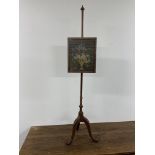 An antique pole screen with needlework tapestry. W:39cm x D:cm x H:150cm