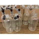 Approximately 50 apothecary bottles some with glass stopper