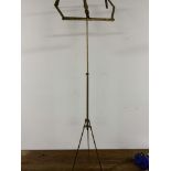 A decorative brass Ormolu extendable music stand. Extended H:146.