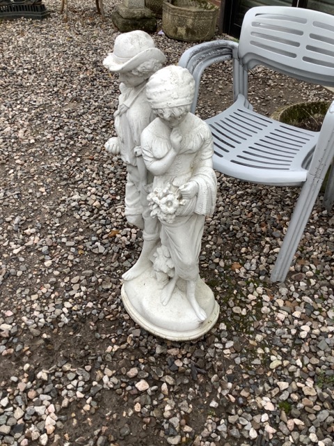 A reconstituted stone figural group of two Breton children. 92cm(h)