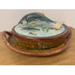 A collection of George Jones style Majolica, lidded fish tureens and other items