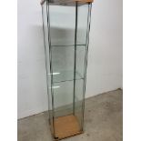 A glass display cabinet. W:40cm x D:40cm x H:163cm
