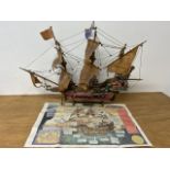 A model of the Golden Galleon with associated newspaper article. W:85cm D25cm H:63