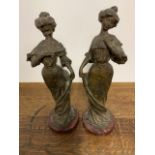 Two bronzed figurtines W:10cm x D:8cm x H:30cm