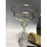 An 18th Century sweetmeat glass, circa 1760 with a multiple spiral opaque twist stem raised on