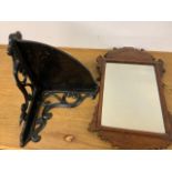 An ornate black painted corner wall bracket also with a wall mirror. W:33cm x D:33cm x H:43cm W:37cm