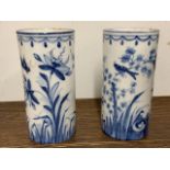 A pair of Ortiental style continental blue and white vases decorated with flora and forna with