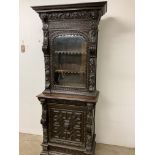 Early Victorian heavily carved glazed shelves over cupboard with single draw and cupboard to base.