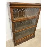 A Globe Wernicke bookcase with leaded glass, 3 glazed sections, base and top. W:87cm x D:30cm x H: