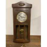 A wall clock, Sonora, with bevelled glass also with pendulum and key W:33cm x D:16cm x H:79cm