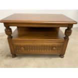 An Ercol television stand with drop flap corner. W:75cm x D:45cm x H:47cm. To: W:75cm x D:80cm x H: