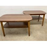 A pair of Formica topped tables with shelf. W:100cm x D:60cm x H:61cm