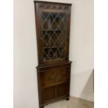 An oak corner unit with leaded glass W:69cm x D:52cm x H:182cm