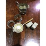 A collection of sterling silver items to include a silver tea strainer. 5.8ozt gross