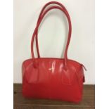 A red leather Radley shoulder bag.