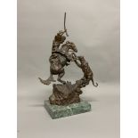 AFTER CHARLES MARION RUSSELL (1864-1926), a bronze model of a cowboy attacking a panther on