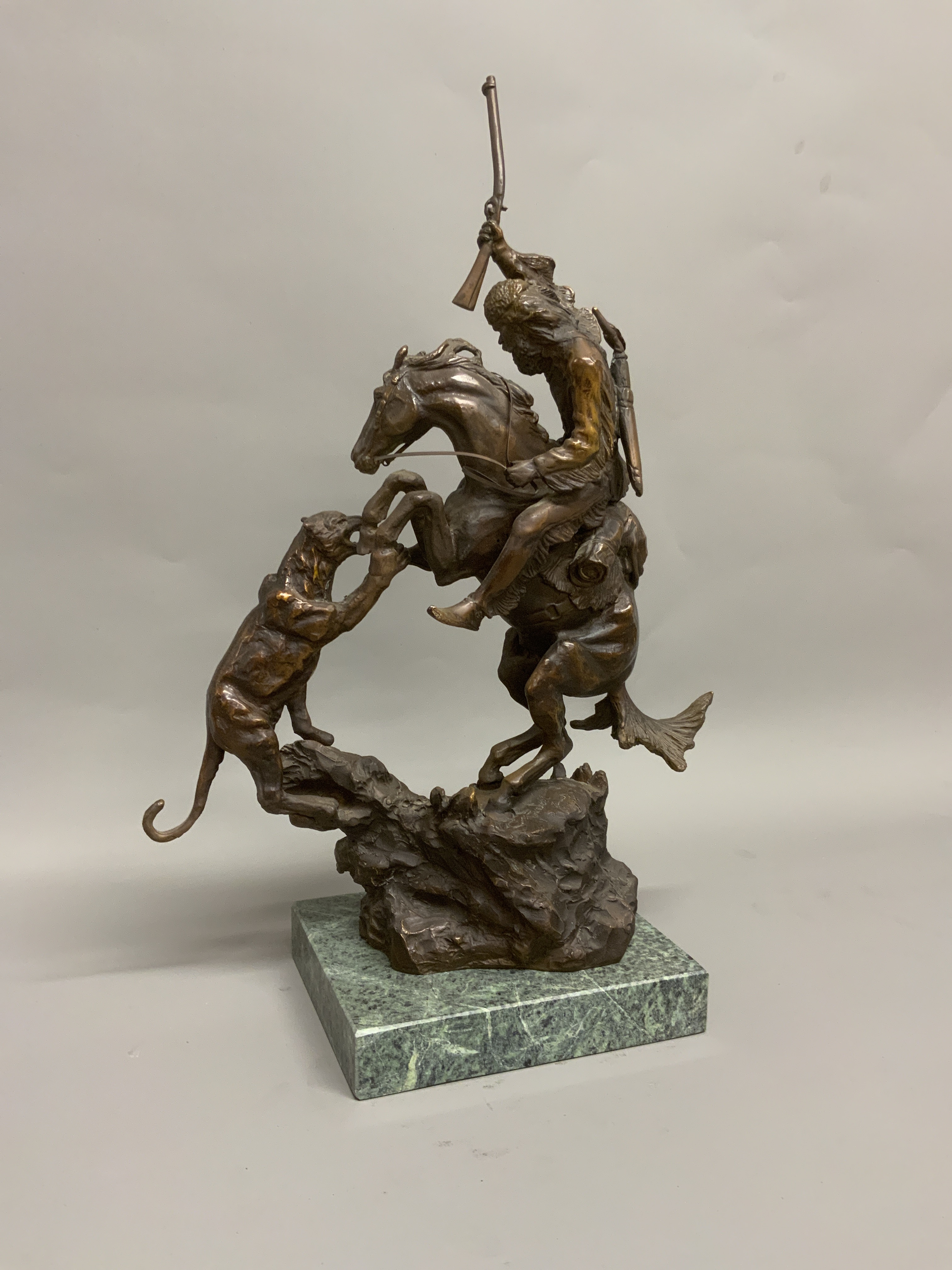 AFTER CHARLES MARION RUSSELL (1864-1926), a bronze model of a cowboy attacking a panther on - Image 2 of 4