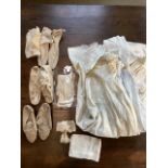 Three Victorian christening robes,hand embroidered and smocked. Together with wedding shoes and belt