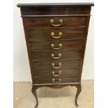 A mahogany music cabinet with seven drawers with drop down fronts and brass handles.W:54cm x D: