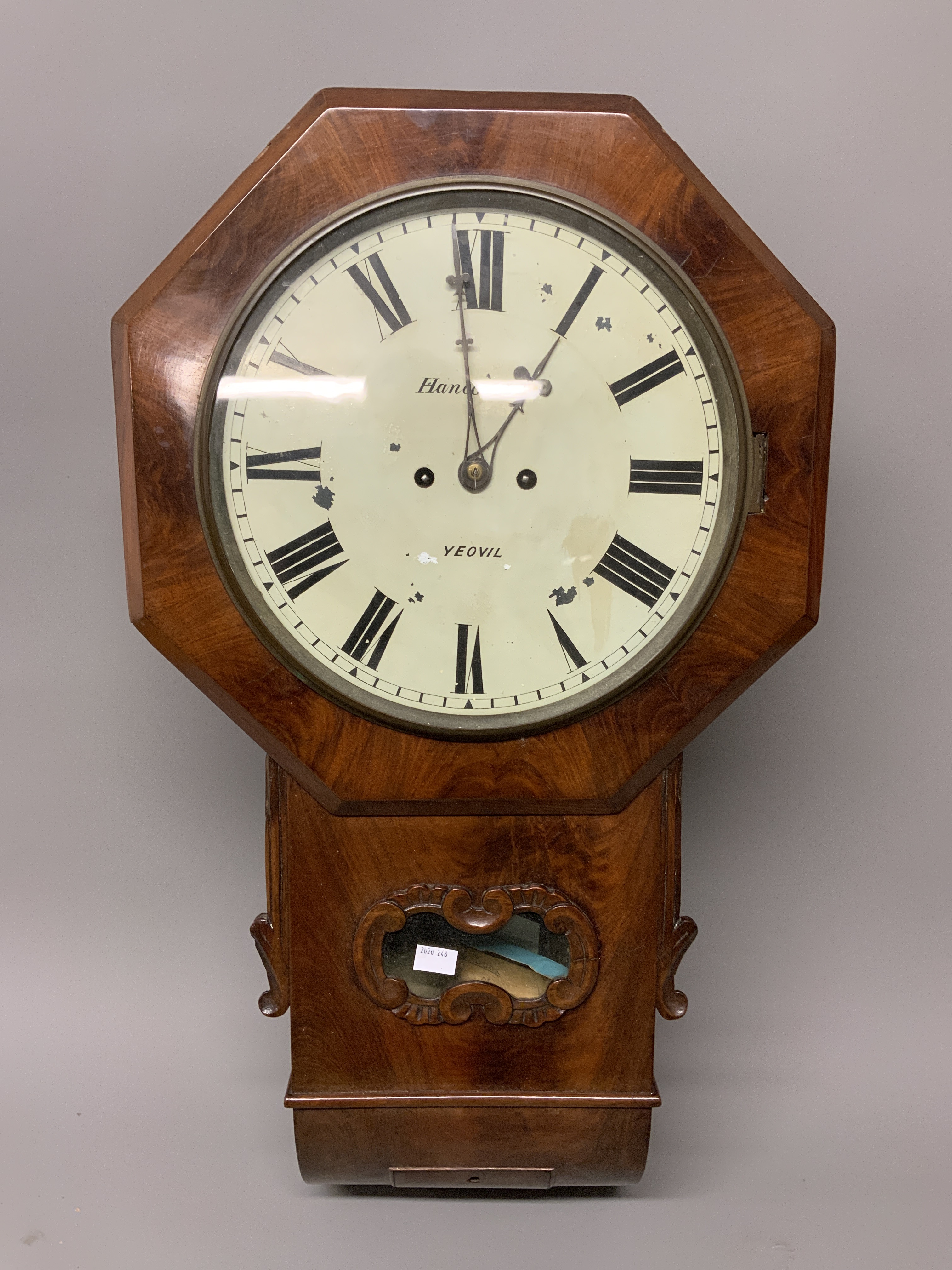 A mid 19th Century mahogany drop head wall clock, the white painted wooden dial signed Hancock and