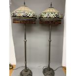 A pair of Tiffany style leaded glass standard lamps with amber drop glass beads. 165cm(h)