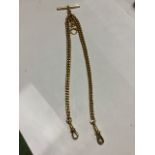 A 15ct gold flat graduated curb link Albert chain with T bar and two lobster claw clasps. All