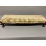 A Victorian long foot stool or coaching stool, upholstered with studded finish, oak and
