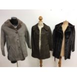 A 1970s sheepskin ¾ coat, a 1970s faux fur jacket and a 1960s suede leather trimmed ¾ coat.