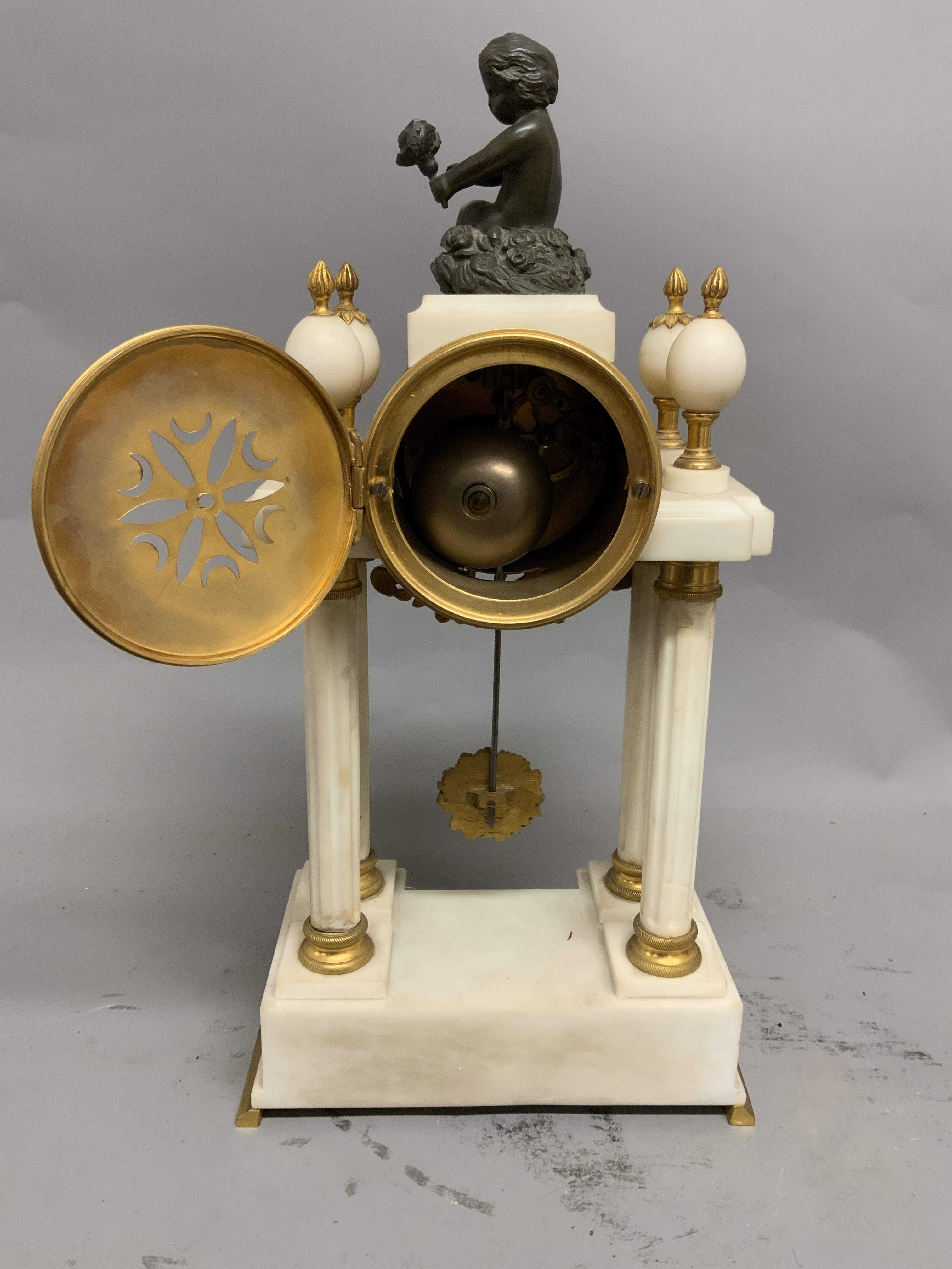 A French marble gilt metal pedestal mantle clock. Enamel face with Arabic markers and floral - Image 3 of 3