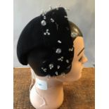Vintage Mannequin head together with a 1950s beaded cocktail hat