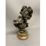 A French bronze bust of laughing lady wearing a bonnet on bronze socle base with foundry mark