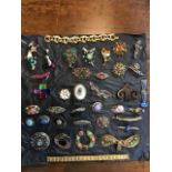 Various items o costume jewellery from the 1920s - 1970s including 1960s gold coloured bracelet