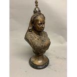 A bronzed bust of Queen Victoria in the manner of T.Theed. On stepped marble socle base. H:41cm