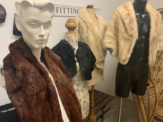 A 1930s mole fur cape with Bakelite button, a 1940s fur shawl together with two 1950s blond mink