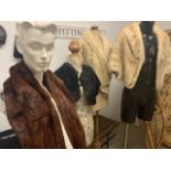 A 1930s mole fur cape with Bakelite button, a 1940s fur shawl together with two 1950s blond mink