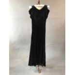 1930s silk velvet gown with ruffled plunging back. Waist measurement 26