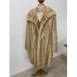 A 1950s blond mink couture fur coat.